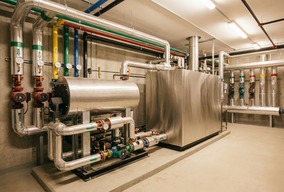 Central heating engineer working on a boiler installation