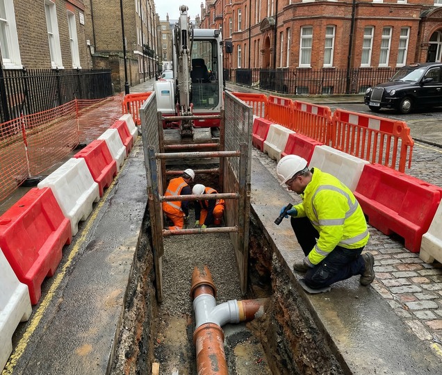 Excavation crew preparing a controlled ground opening for drainage repair works.